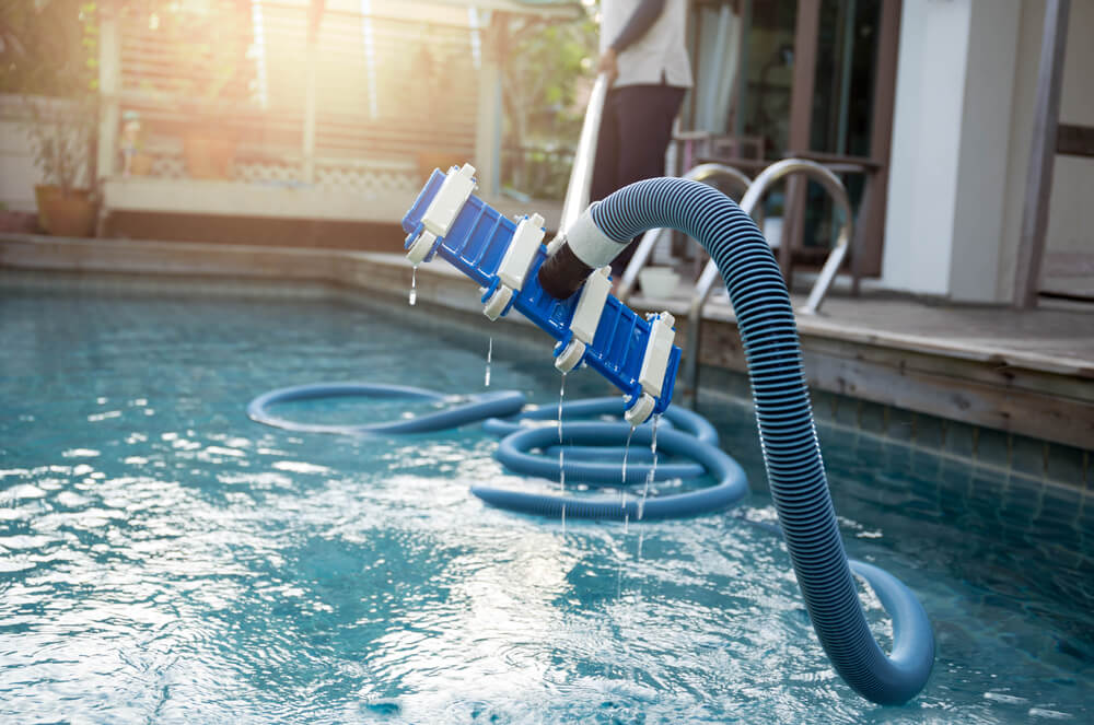 suction pool cleaner coming out of pool